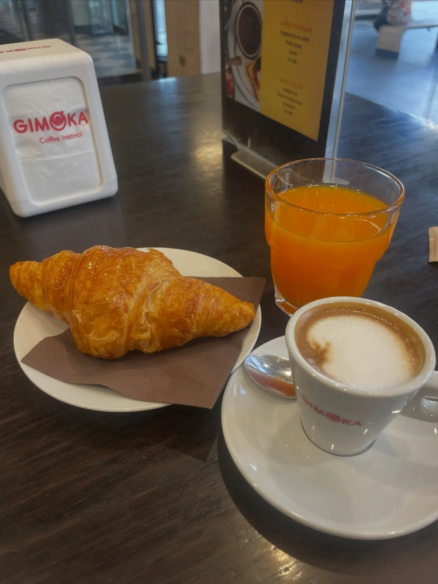 Croissant, orange juice, and coffee
