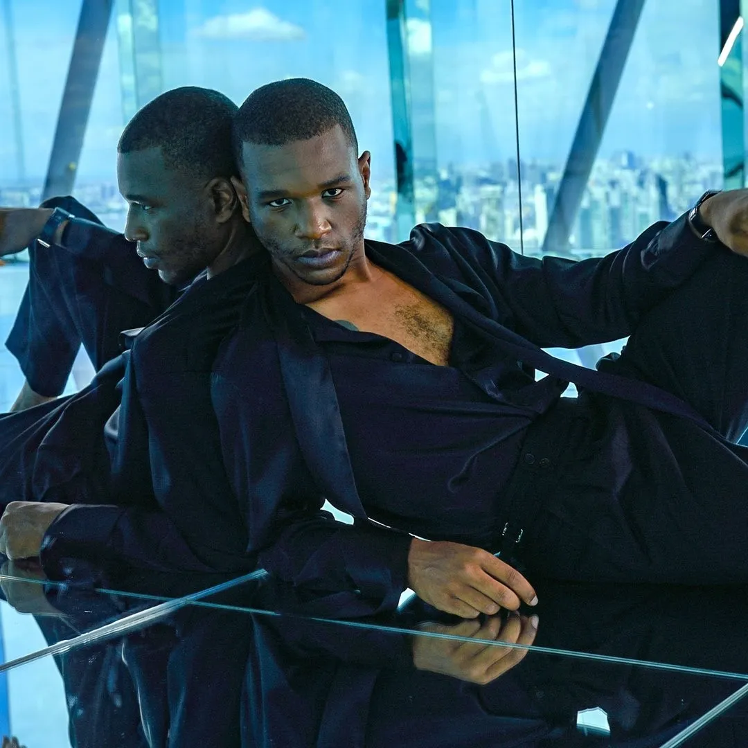 Travon Ridley-Evans and his reflection, glass walls behind
